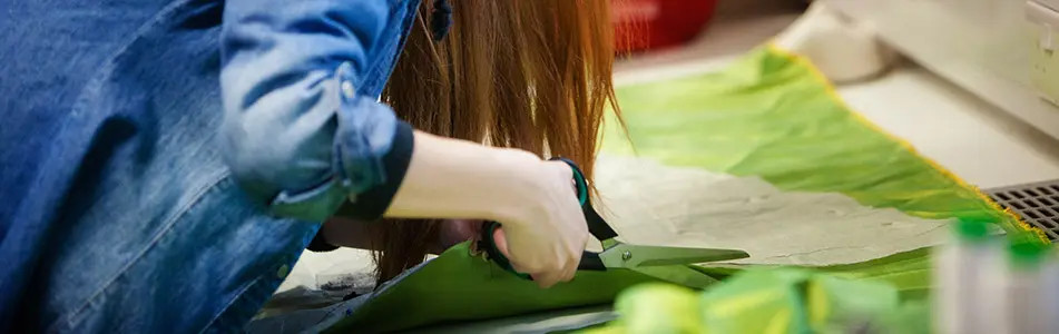 girl cutting material